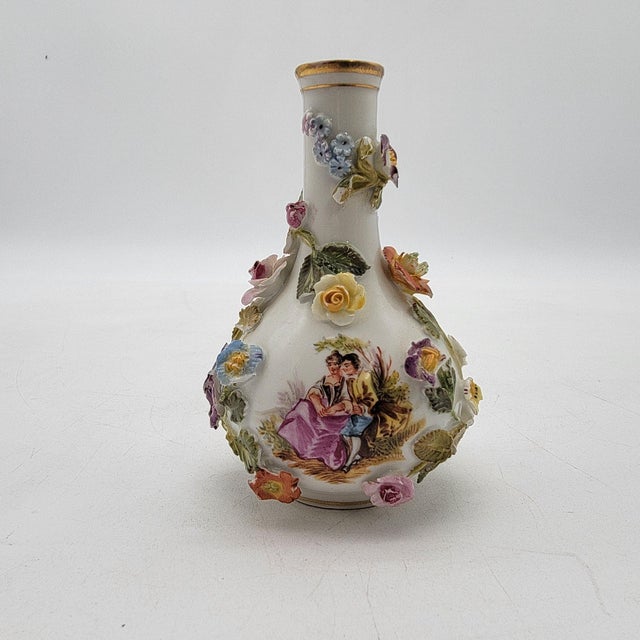 These exquisite antique vases exhibit the timeless elegance of Dresden craftsmanship, adorned with intricate floral...