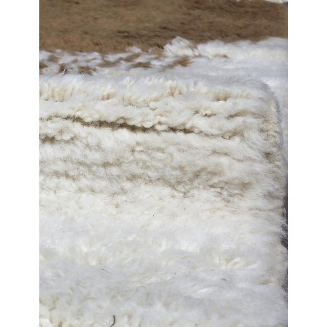 Boujad Rug | Handwoven Berber Wool Rug with Abstract Sculptural Shapes This playful Boujad rug features a clean ivory...