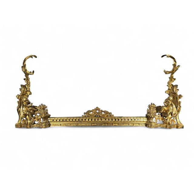 Elegant fireplace fender in finely gilt bronze, crafted in France during the 19th century. The piece features classical...