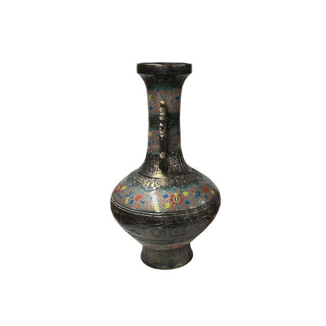 Immerse yourself in the opulent beauty of this magnificent ceramic vase, a true testament to artistry and tradition. Its...
