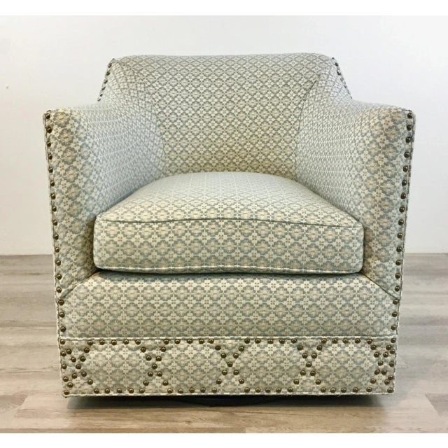 Stylish TCS Designs Modern Blue and Taupe Geometric Swivel Club Chair, ivory background, antique silver nailhead accents,...