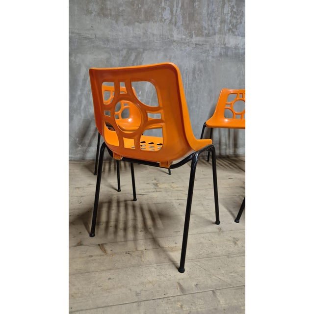 A sculptural set of four vintage chairs from 1970s East Germany, designed in a distinctive Space Age aesthetic. Their bold...