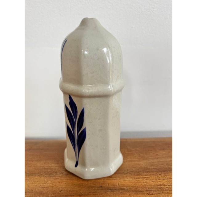 Beautiful North Carolina pottery sugar dispenser with blue leaf design. rubber stopper on base for easy fill. Most items...