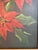 This vintage original oil painting likely dates to the mid-late 20th century and depicts vibrant red poinsettias...