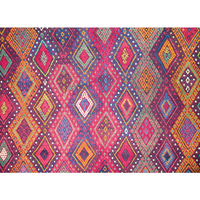 A stunning vintage mid-20th century Uzbek Sumac rug with the most wonderful all-over diamond pattern woven in myriad...
