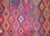 A stunning vintage mid-20th century Uzbek Sumac rug with the most wonderful all-over diamond pattern woven in myriad...