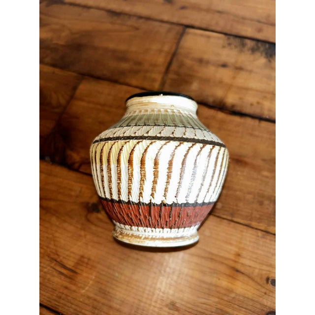 Add a touch of iconic Mid-Century design to your home with this striking Vintage Dumler & Breiden Sgraffito Vase, a...