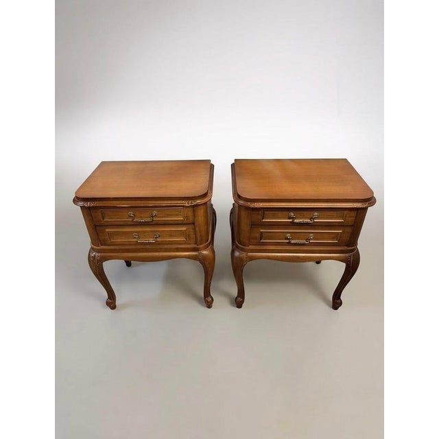 A seriously cool pair of vintage French nightstands crafted in rich, character-filled carved wood. Designed with two...