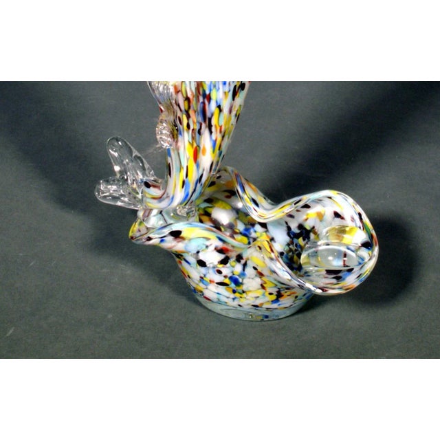 Italian Murano End of Day Fish Sculpture Ashtray 1960's. The vase, is in the form of a fish, with multi-colored strands of...
