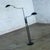 Marvelous vintage Postmodern floor lamp Model 2505 by Holtkotter Leuchten composed of a pharmacy style black metal frame...
