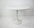 A very nicely sized 42" Dia. cafe or dining table with a round white Laminate top and matching steel tulip base . The...