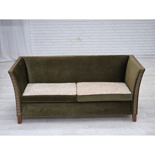 1970s, Danish 2-seater sofa. Original green furniture velour, oak wood legs, brass springs in the seat cushions. Double...