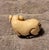 An exceptional and charming antique Chinese carved ivory netsuke depicting a recumbent pig. Expertly hand-carved from...