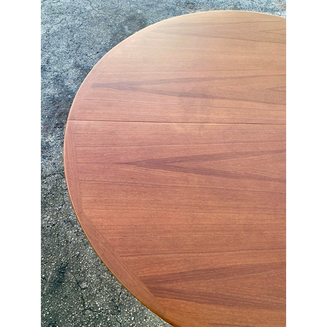 Mid-Century Modern Danish Teak Extendable Dining Table, consistent with designs by Ib Kofod-Larsen for Faarup Møbelfabrik....