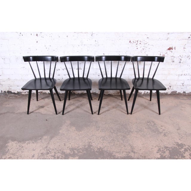 A gorgeous set of iconic mid-century modern spindle back dining chairs Designed by Paul McCobb for Winchendon Furniture...