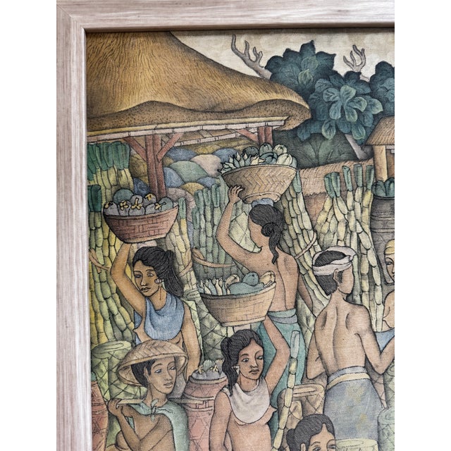 This vintage artwork is a Balinese Ubud-style painting depicting a traditional market scene.It is rendered in a muted...