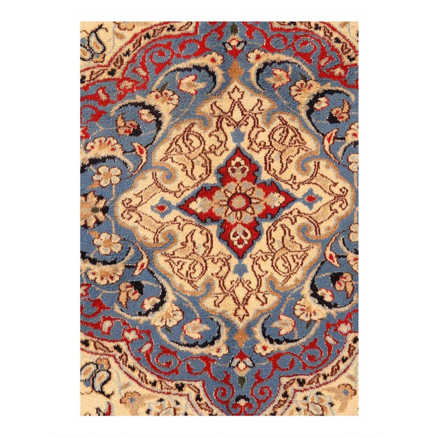 This vintage Nain rug offers a rare and unusually warm interpretation of the classic Nain design vocabulary — departing...