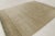 This 9x12 Art Deco geometric rug, hand-knotted in wool, features a softly textured beige field with fine linear detailing...