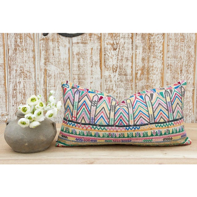 These colorful throw pillows are made from Rabari tribal dowry bags. The embroidery is on cotton and has intricate chain...
