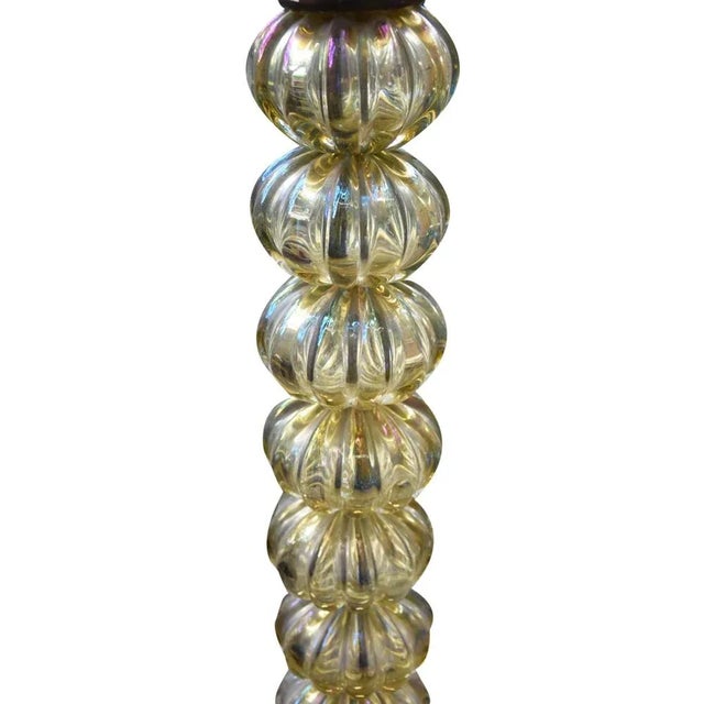 This Italian floor light in blown glass was designed by Tomaso Buzzi for Venini circa 1930. This piece is attributed to...