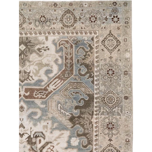 This mid-20th-century Turkish Anatolian accent rug presents a boldly structured medallion composition in muted ivory, pale...