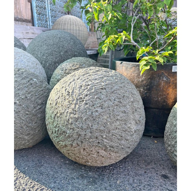 Rustic stone garden sphere hand-carved from granite. Each slightly unique in natural textures, tones and patina. A...