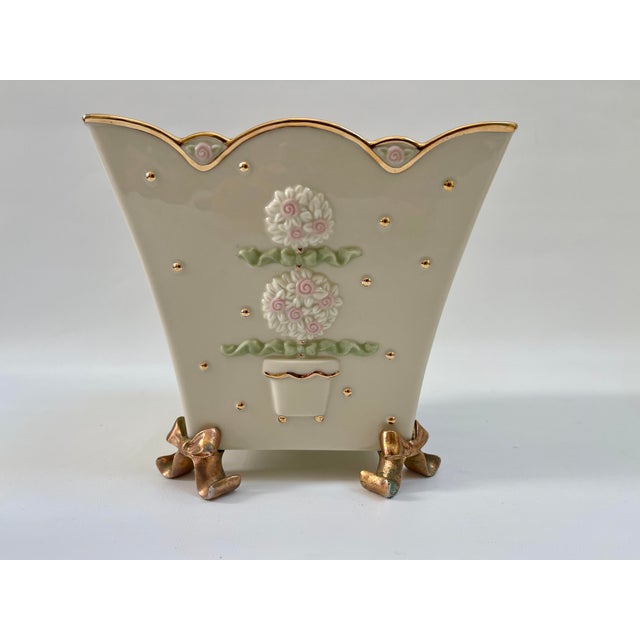 Elegant Lenox Gilt porcelain flower pot with center pink decorated topiary plant and supported by intricate bowes for...