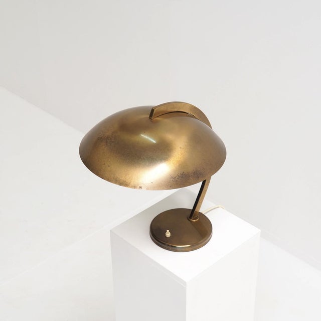 This lamp, designed in the 1950s by Josef Brumberg for JBS Josef Brumberg Sondern, features gracefully curved lines and a...