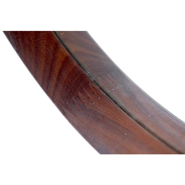 Vintage round mirror in Italian wood, Italy, 1960s. Production period: 1960s. Dimensions: 52 cm wide x 5 cm deep x 52 cm...