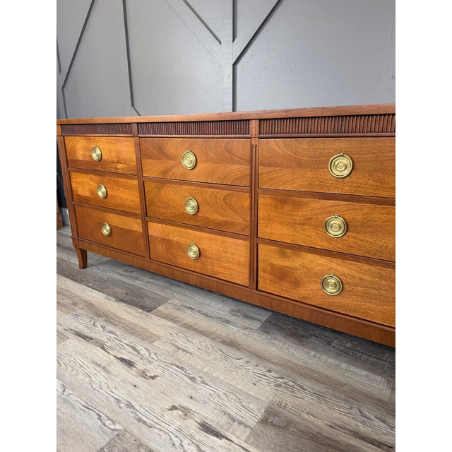 'Distinctive Furniture' by Stanley This dresser is an iconic mid-century modern piece with gorgeous walnut wood and brass...