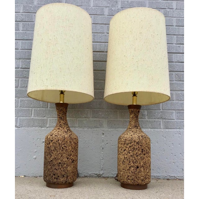 A pair of striking mid-century table lamps that capture the organic warmth and sculptural elegance that defined the era....