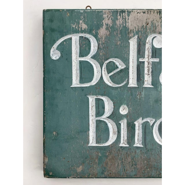 Found in Maine vintage wood incised lettering "Belfast Birches" one sided sign in old blue paint. Sign has original hooks...