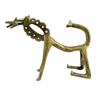 Antique African Abstract Figurative Brass Lion With Prey in Mouth Figurine For Sale