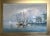 This original oil painting on canvas by artist K. Basset captures a serene and atmospheric harbor scene. Two docked...
