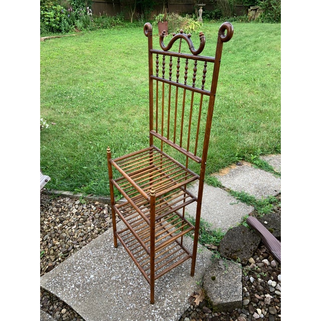 This antique 19th-century bentwood stick and ball shelf is a striking example of early bentwood craftsmanship, blending...