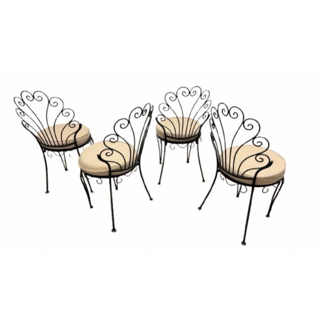 A great set of four Italian vintage wrought iron/ metal dining chairs, perfect indoor or outdoors, they are original...