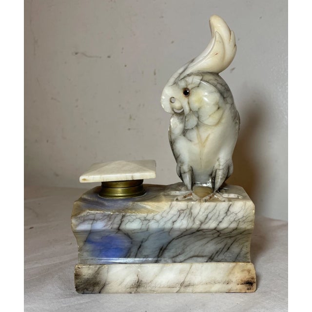 Experience the essence of Italian artistry with this antique carved figural alabaster stone cockatoo inkwell. Each...