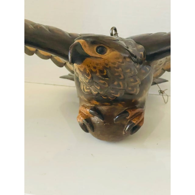 Vintage handcarved wood sculpture of flying American Eagle.