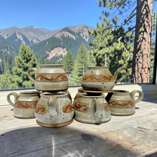 A matched set of eight late twentieth-century studio pottery coffee mugs by California ceramic artist Joy Imai. Each...