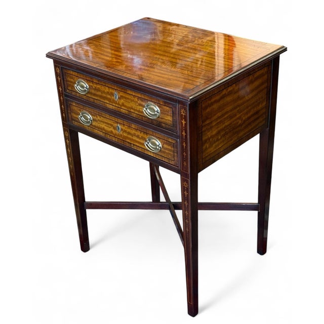 Vintage Heritage 2-drawer stand with marquetry. Beautiful mahogany veneers with ebony banding on the top and drawer...