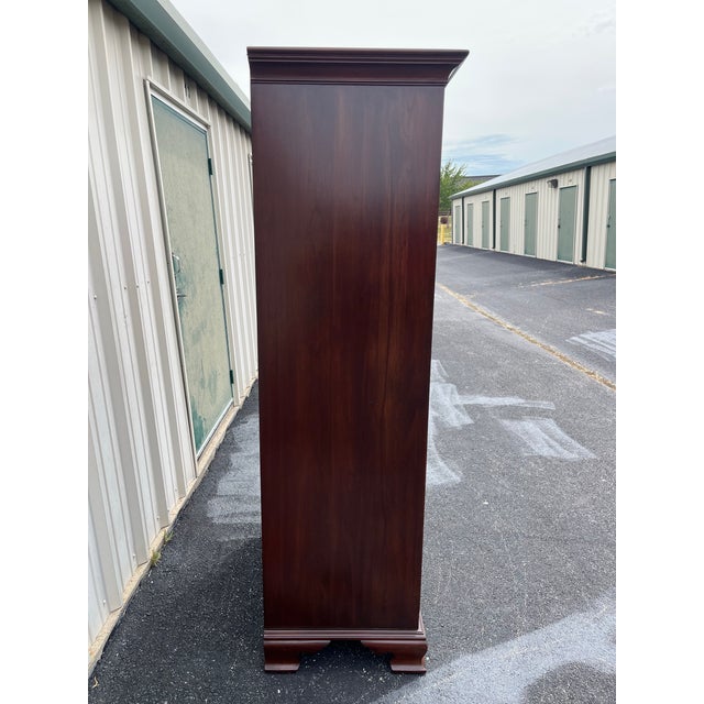 A large bedroom clothing armoire wardrobe from Ethan Allen’s iconic “Georgian Court” collection. Made in the 19080’s, this...
