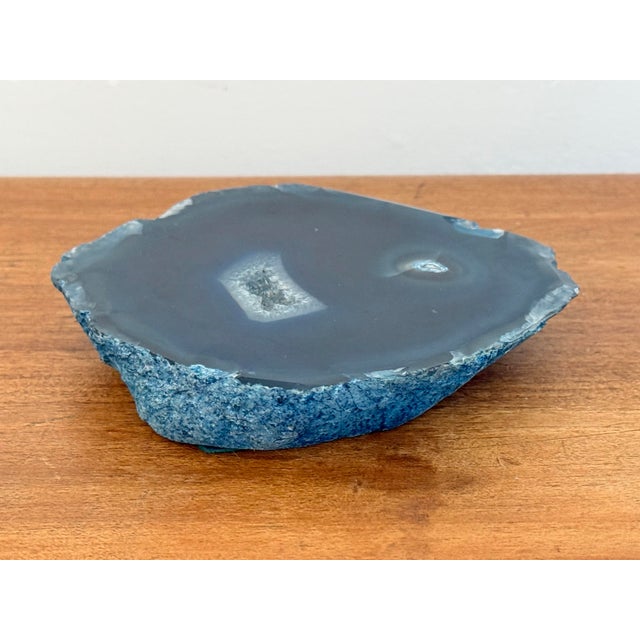 A polished blue agate mineral slab with natural banding, a small accent with many potential uses, like a coaster or a tiny...
