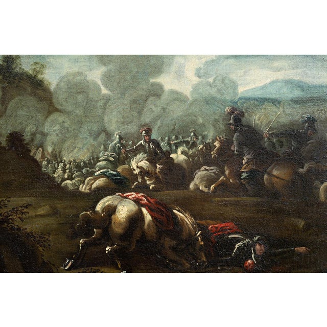 An antique oil painting on canvas depicting a battle between Christian and Turkish knights, set in a period gilded wooden...