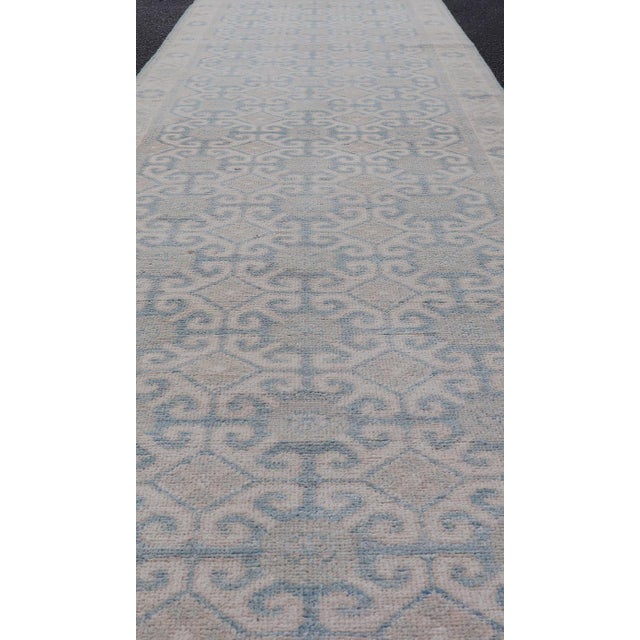Afghan Khotan Tribal Runner in Ivory With Soft Blue and Sand Motifs For Sale - Image 4 of 10