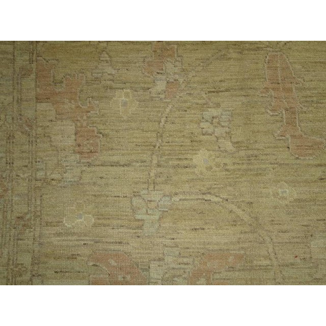 A stunning, subtle Turkish Oushak carpet with an all-over design on a soft beige field, soft grey border with some lime...