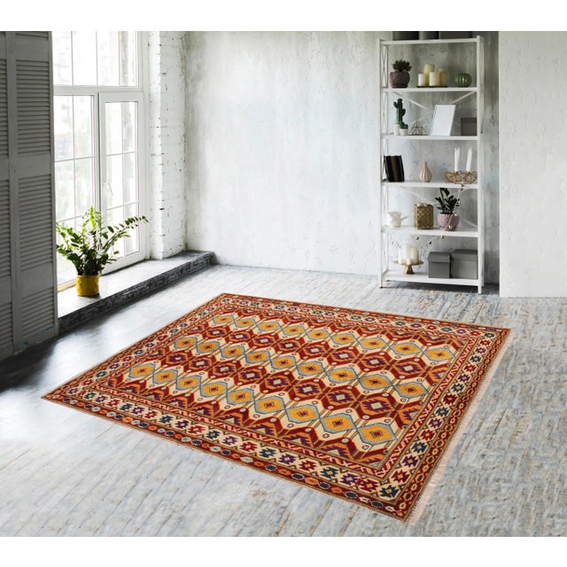 A mesmerizing addition to any decor, this exhilarating hand-knotted rug featuring exquisite coloration in an intricate...