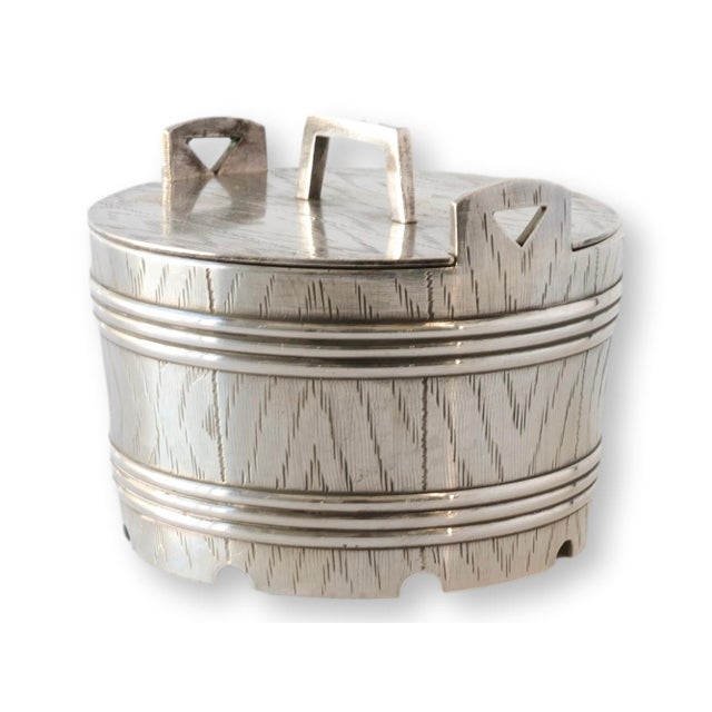 This 19th century silver-plate barrel-form butter dish features a charming lidded design with glass insert, modeled after...