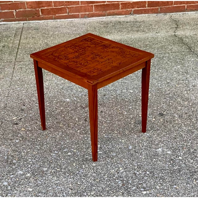 The Frame: Features Hansen's signature tapered legs and angular, seamless mitered joints linking the legs directly to the...
