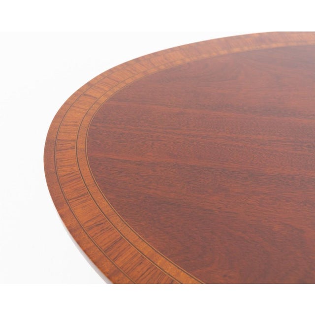 A superb mahogany oval coffee table by the renowned makers Arthur Brett & Co. of Norwich, celebrated for producing...
