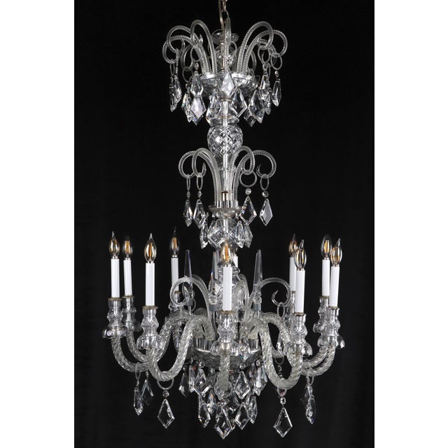 Vintage Bohemian style crystal chandelier with three tiers of molded glass arms hung with a profusion of faceted crystals....